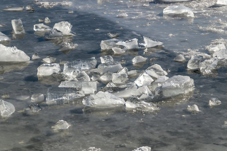 Melting crushed ice in water in nature