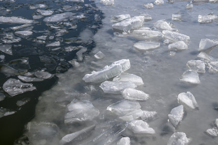 Melting crushed ice in water in natureの写真素材