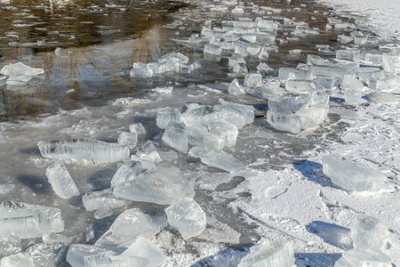 Melting crushed ice in water in natureの写真素材
