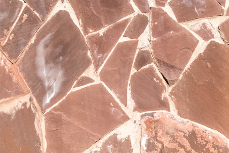 Wall decorated with natural natural stone close-up as a background.の写真素材