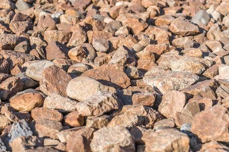 Crushed granite railway embankment close-up.