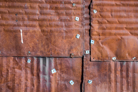 Old rusty tin plate as background close-upの写真素材
