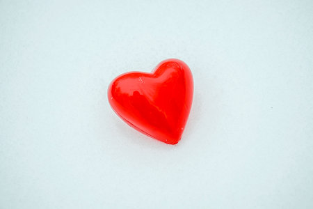 Box in the form of a heart in the snow in winter.Give a gift for valentine's dayの写真素材