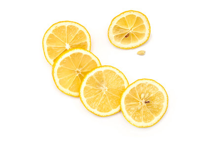 Bright ripe sliced lemon isolated on white background.の写真素材