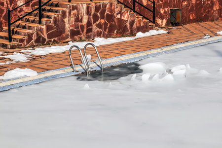Ice on a frozen pool in nature in springの写真素材