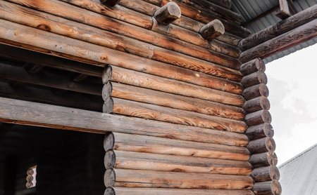 Old wooden unfinished house from logsの写真素材