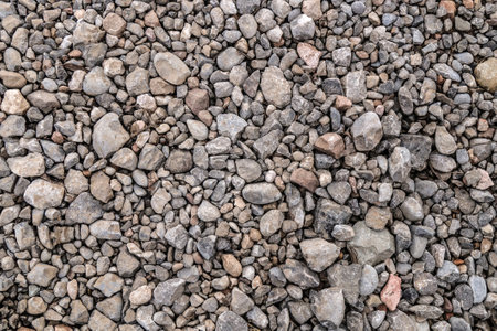 Building material stone rubble on road surface as backgroundの写真素材