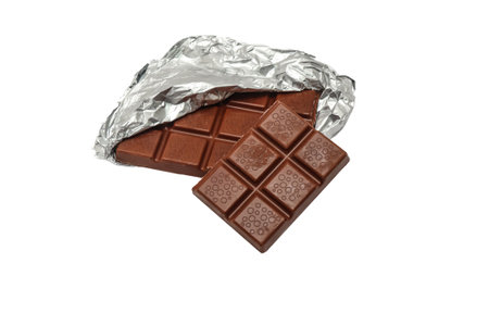 Milk chocolate with foil on a white backgroundの写真素材