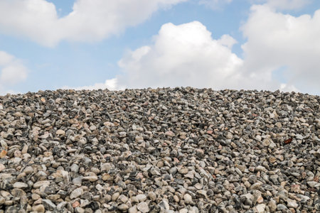 A pile of building rubble against the sky. Stock of inert building materialsの写真素材