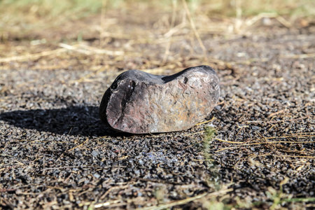 A large stone cobblestone lies on the ground