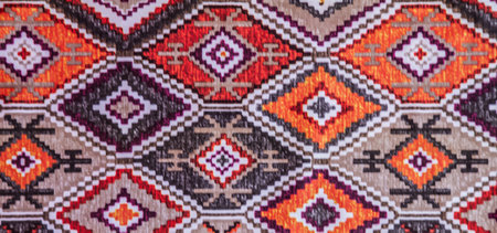 Detail of a colorful hand-woven Indian rug.