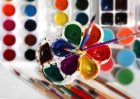 Paint palettes and brushes. Selective focusの写真素材