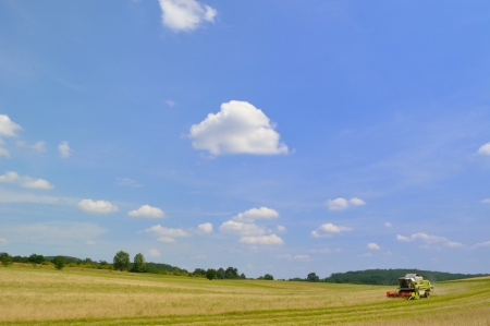 Combine harvester at work on field Agriculture and Farming Collection の写真素材