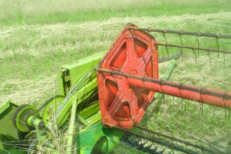 View from the combine harvester in the wheat field during harvesting の写真素材