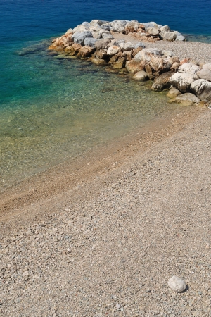 Beautiful beach with stones on Podgora, Croatiaの写真素材