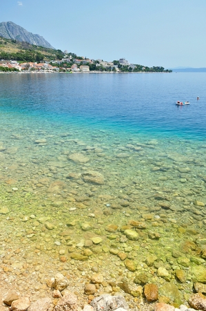 Adriatic sea at Podgora in Croatia with crystal clear sea and mountain Biokovo の写真素材