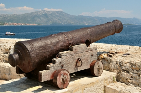 Old cannon at old fortress in medieval town Korcula in Croatiaの写真素材