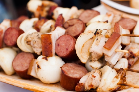 Barbecue Shish kebab With sausage, onion and baconの写真素材