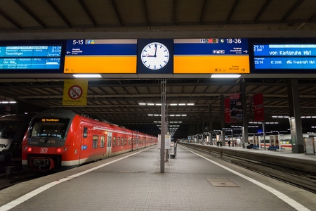 MUNICH, GERMANY - FEBRUARY 18, 2016: A commuter train waits at the Munich Main Railway Station (Munchen Hauptbahnhof). The train is part of Deutsche Bahn's fleet, the German national railway company.のeditorial素材