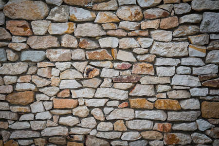 Stone wall background of colorful stonesの写真素材