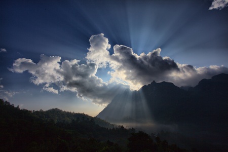 Sunshine behind cloudの写真素材