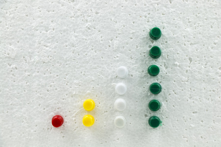 Colorful pins on polystyrene business growth chart.の写真素材