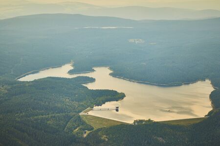 Aerial photo of water dam Josefuv dul surrounded by forests and hillsの写真素材