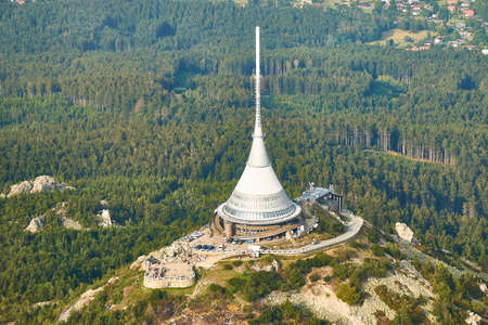 Jested, Czechia - 08/25/2019: Close up aerial view of Jested tower transmitter near Liberec in Czechia.のeditorial素材