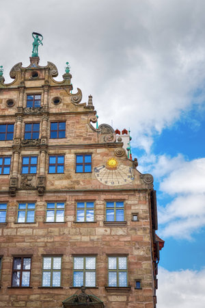 Old historic Fembohaus. Sun clock on the wall. Nuremberg, Germanyの写真素材