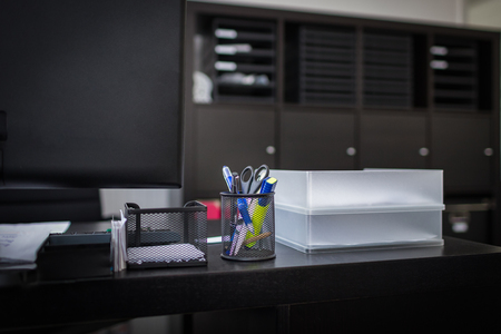 Workplace with office accessories on a dark backgroundの写真素材