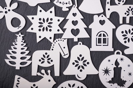 White wooden Christmas decorations on a black backgroundの写真素材