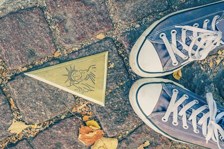 Colmar, France. October 14, 2018. Feet selfie and tourist sign with Statue of Liberty