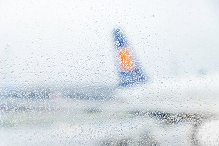 Copenhagen, Denmark. November 29 2018. Raindrops on window glass and airplaneのeditorial素材