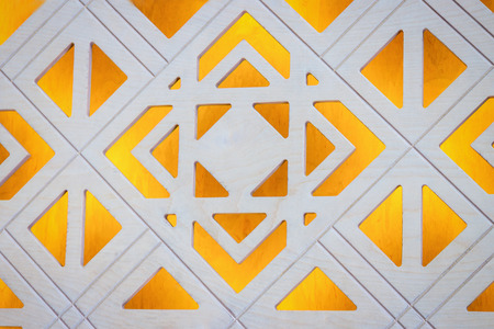 Beautiful hand carved yellow white wooden door. Fragment, detailsの写真素材