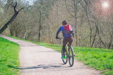 Male cyclist in helmet in a road outdoors. Healthy lifestyle and adventure concept.