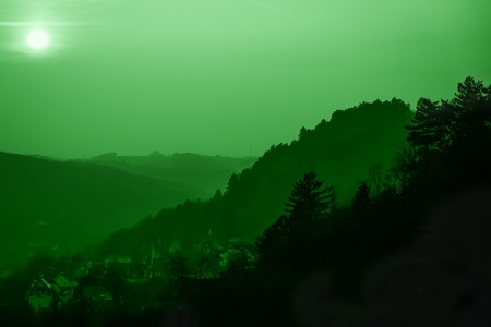 Panoramic view of hills and old town. Sunset. Green mint toned. Jena, Germanyの写真素材
