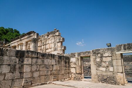 Ruins of a Synagogue in the old fishing village Capernaum, Israel. Blue sky, sunny dayの写真素材