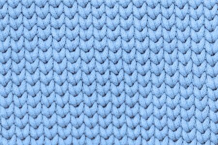 Light soft blue knitted fabric texture background