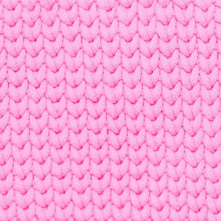 Pink color knitted fabric soft texture backgroundの写真素材