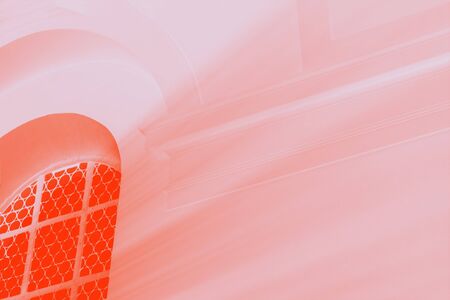 Light rays through the window. Orange lush lava and pale pink colors. Toned photo