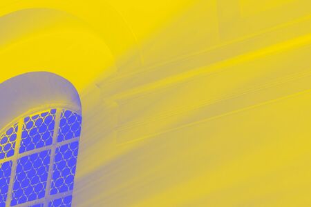 Light rays through the blue window, yellow toned photo
