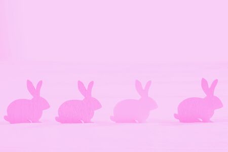 Pink gradient Easter bunny on a pink background. Copy spaceの写真素材