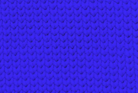Deep blue knitted fabric texture background with patternの写真素材