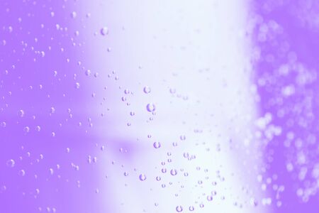 Light violet and white colors blurred background with water drops