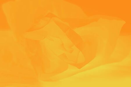 Orange yellow background, wrapping soft paper, abstract blurred backgroundの写真素材