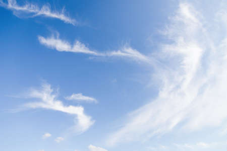 Light blue sky with blurred white clouds, sky backgroundの写真素材