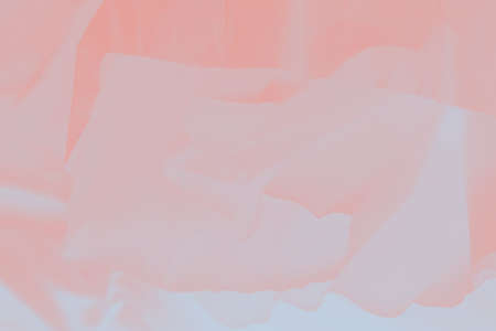 Soft light pink coral color flowing fabric, gradient coral background