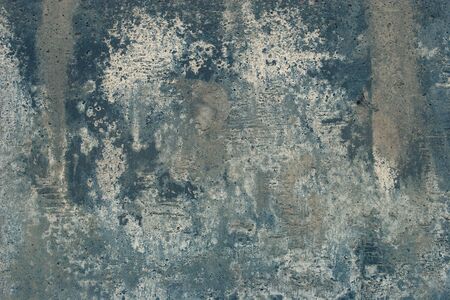 Abstract grunge background. Old cracked concrete with smudges. Gray, blue white colors.の写真素材