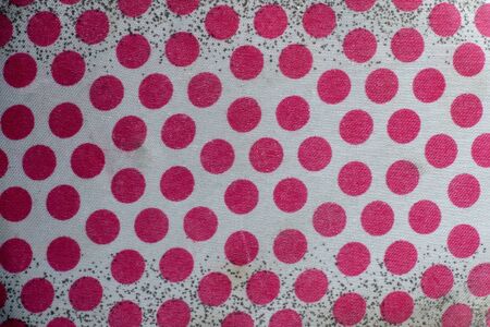 The texture of the old white fabric with red polka dots and black dots on a white background. A lot of red circles. Placers of black dots on both sides.の写真素材