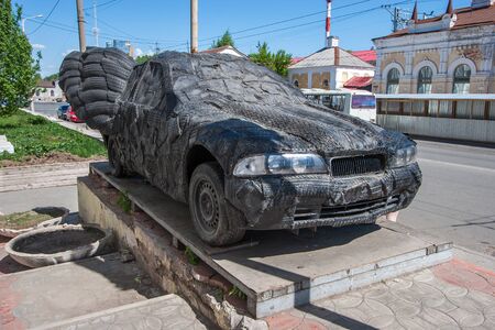 The machine is completely glued with tires on a pedestal. Tires cut into strips. The tread is visible.の写真素材
